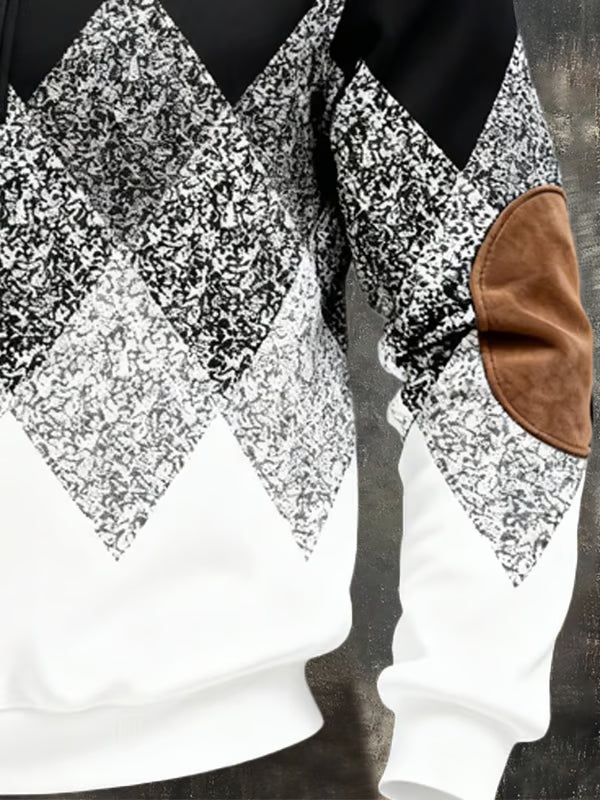 Close-up of the grey argyle pattern, ribbed hem and brown elbow patch on the sleeve 4