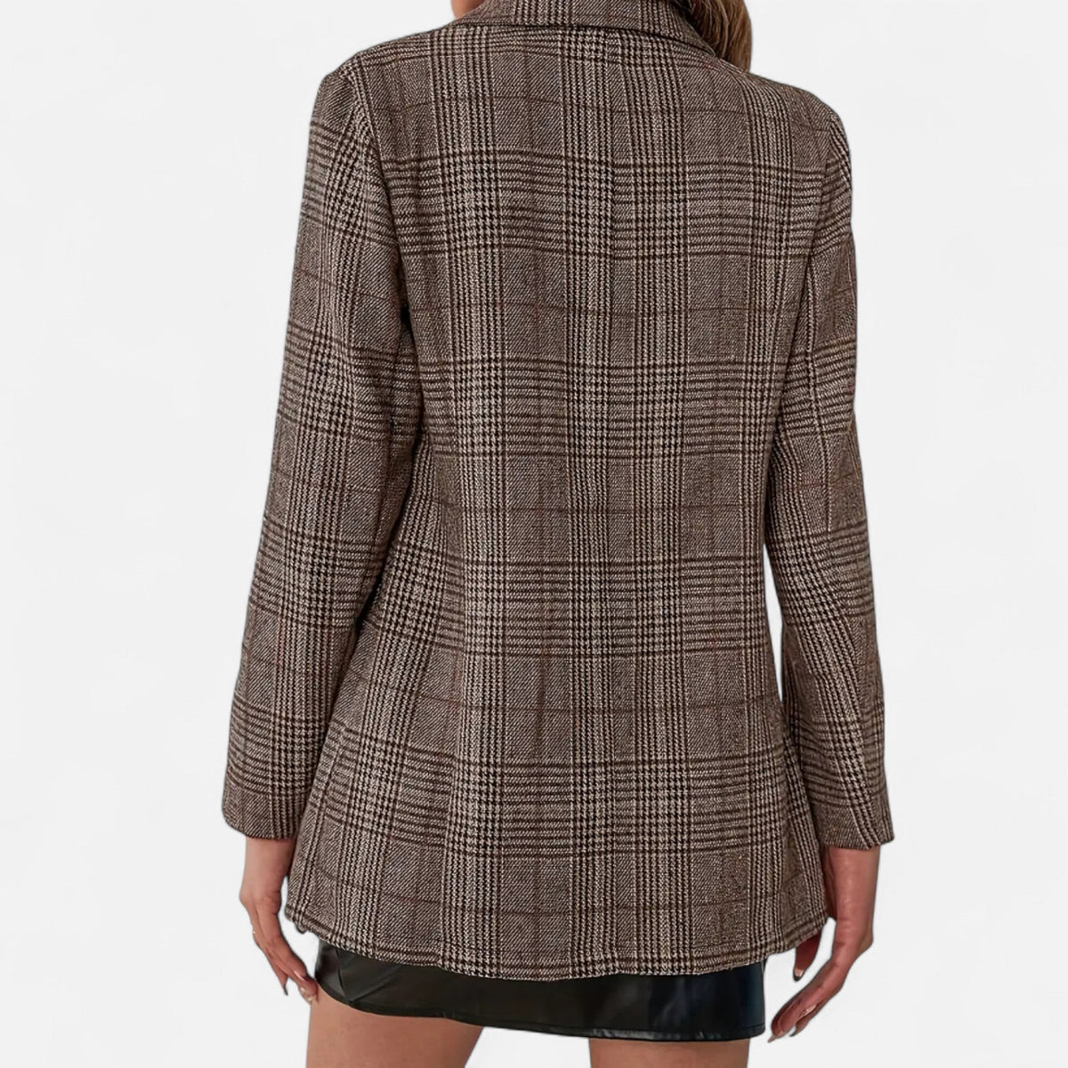 Close back view of the brown checked blazer on a model, showing the plain back panel, long sleeves and houndstooth-style check pattern. 4