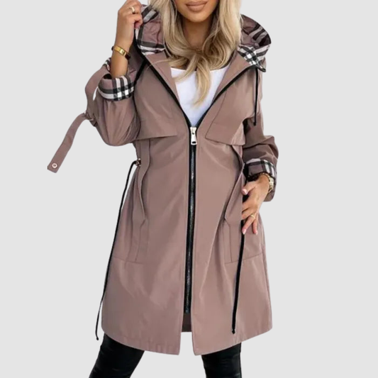 Model wearing the mocha-brown hooded coat unzipped over a white top, showing the checked hood lining, cuffs and waist drawstrings. 1