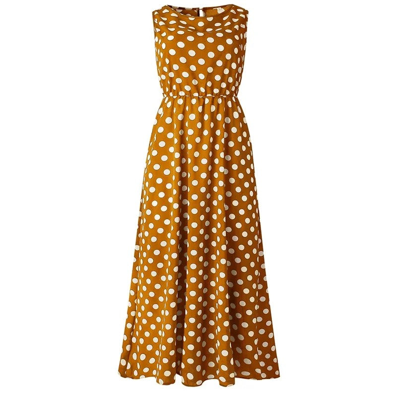 Mustard yellow dress with white polka dots shown flat from the front, with elasticated waist 8