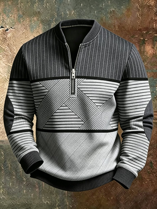Front view of the jumper in charcoal and pale grey, showing the half zip, ribbed collar, striped panels and elbow patches. 2