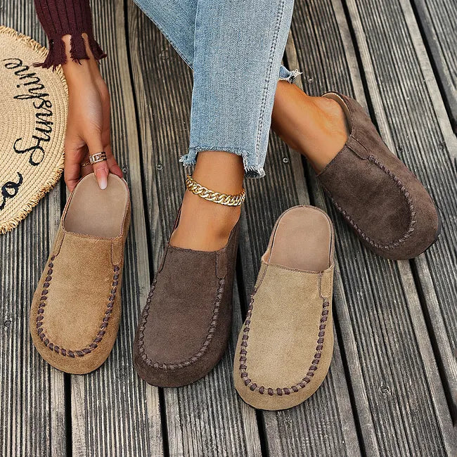 Two pairs side by side on decking, one in tan and one in dark brown, with insoles visible on the tan pair. 7