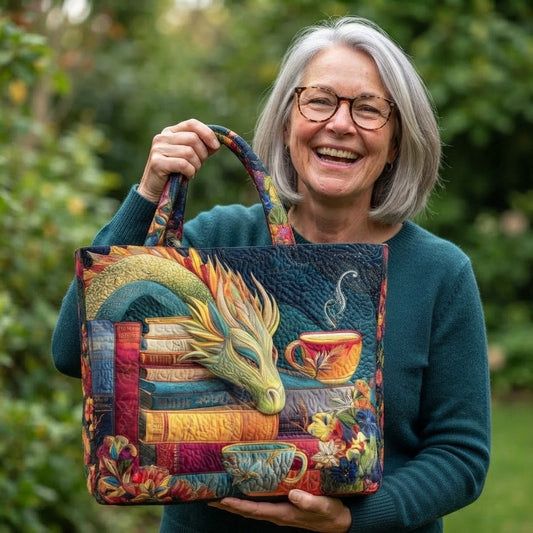 Smiling grey-haired woman in glasses and a teal jumper holds the tote up by one handle in a garden 2