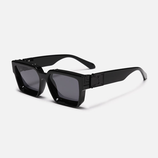 Chunky square glossy black sunglasses with dark grey lenses, angled three-quarter view showing the black metal hinge plate on the wide arm. 1