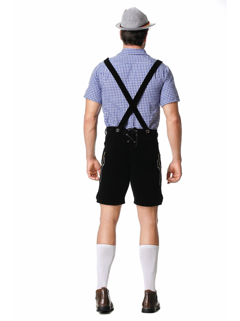 Back view of a model in the black lederhosen, showing crossed braces, lace-up back panel, gingham shirt, grey hat and white socks. 5