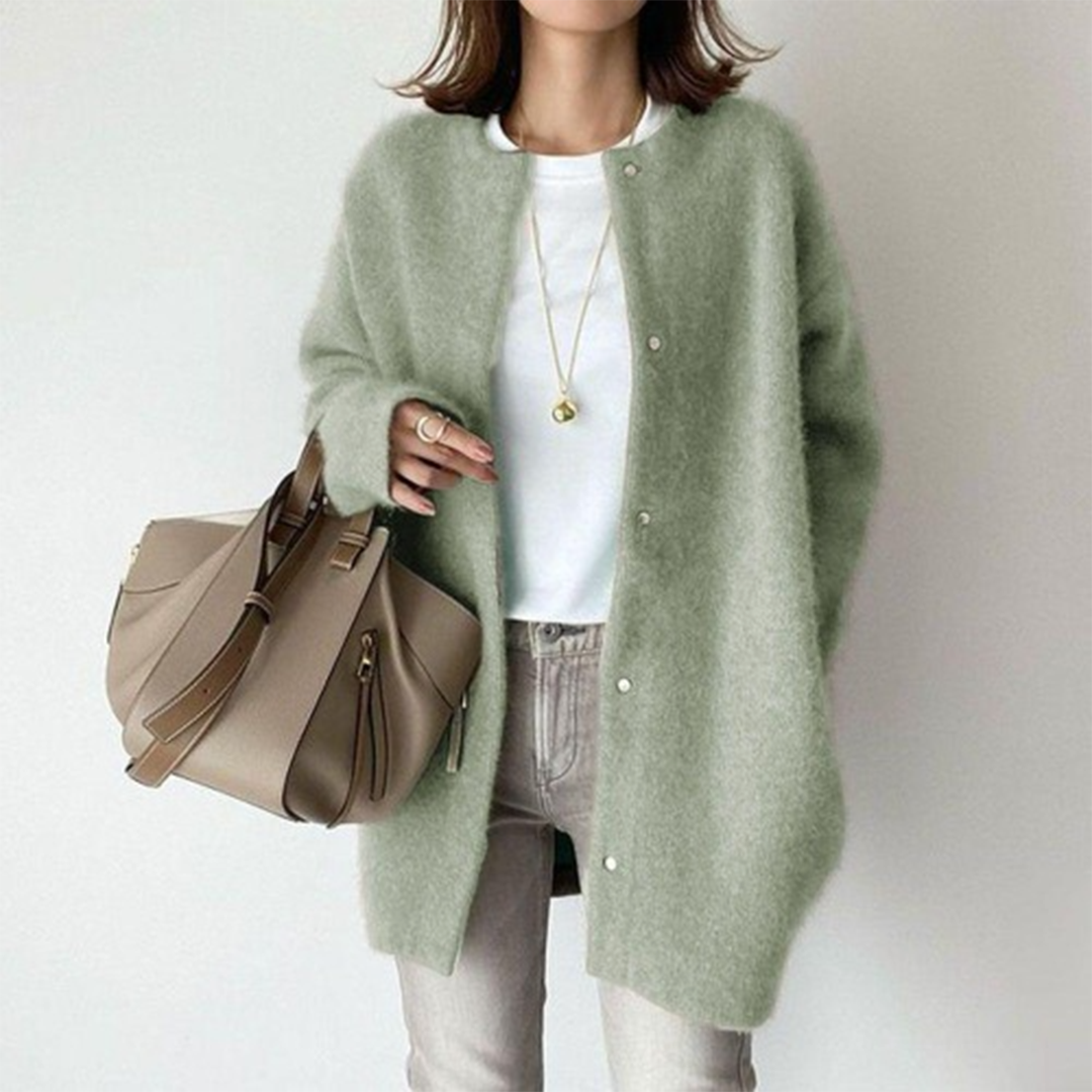 Model wears the same snap-button cardigan in soft sage green, styled with a white tee and grey jeans 8