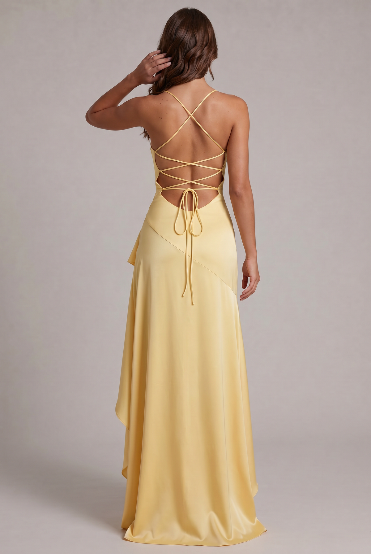 Back view of pale yellow dress with criss-cross lace-up back and long flowing skirt 32