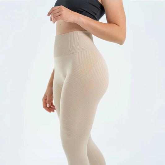 Side view of beige leggings with a ribbed waistband and woven stripe pattern at the hip 2