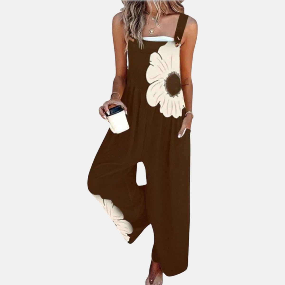 Model wearing brown wide-leg dungarees with a large cream flower on the bib, front view 12