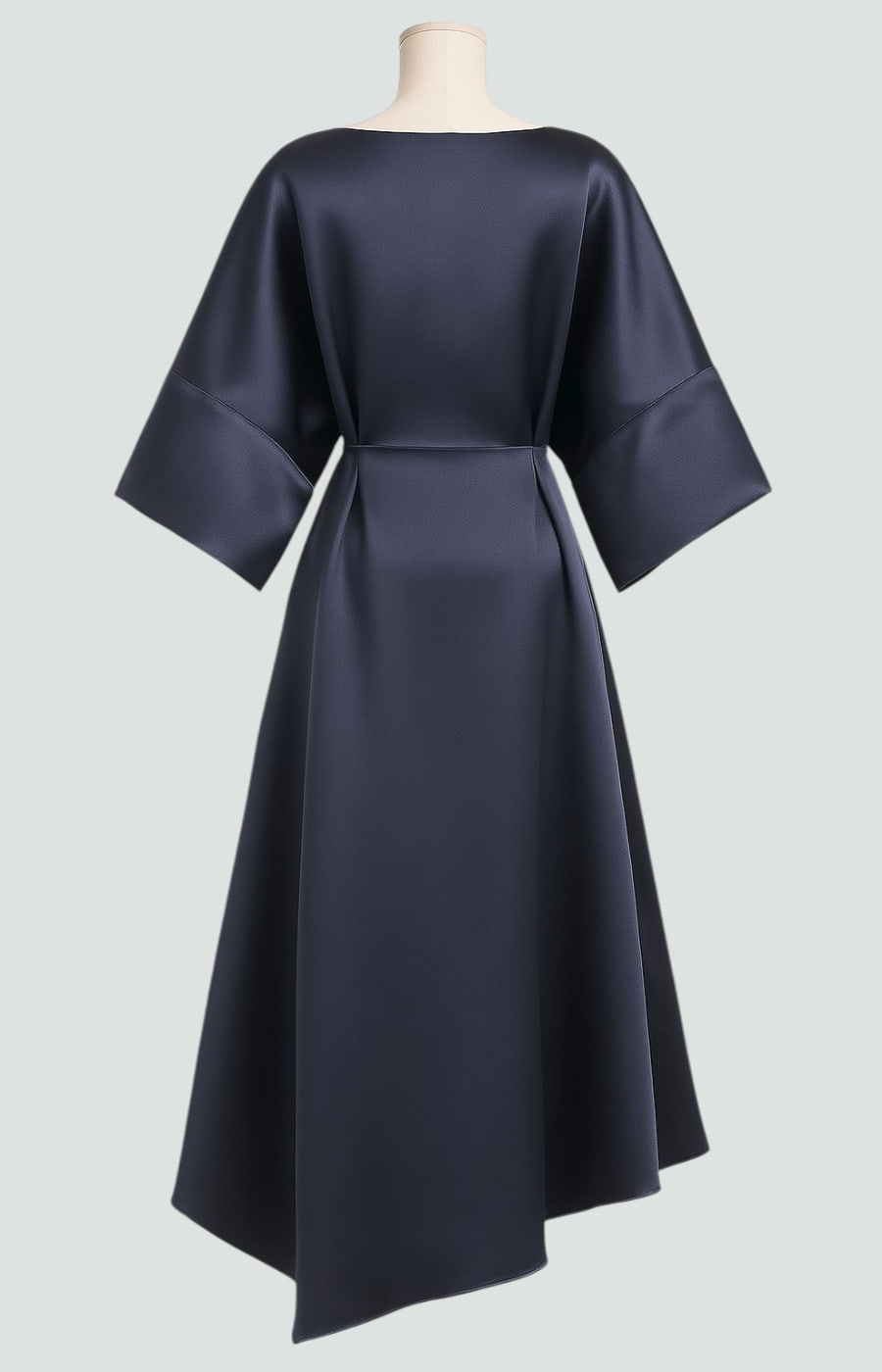 Back view of the navy satin dress on a mannequin, showing the smooth bodice, seam at the waist and asymmetric hem. 8