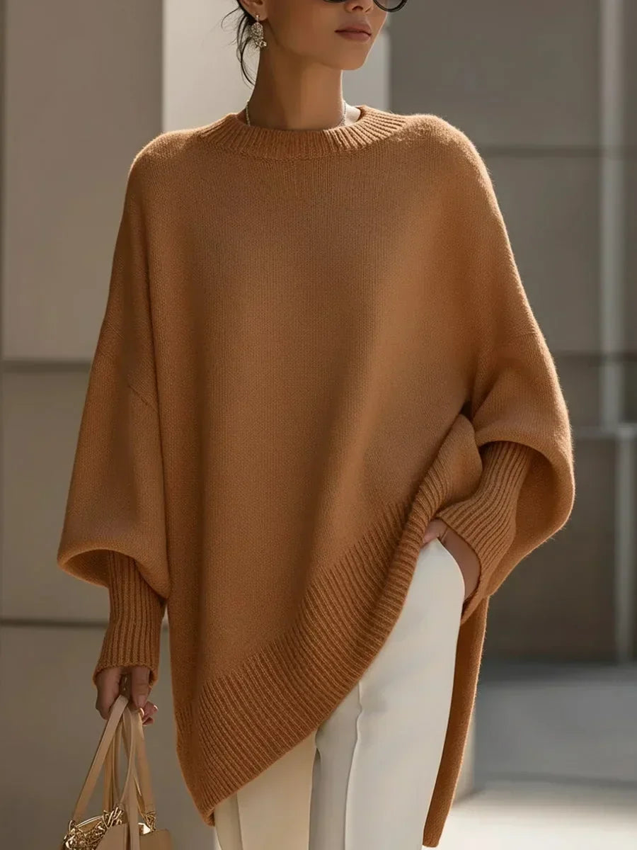 Model wearing the caramel brown version of the jumper, with ribbed cuffs and sloping hem 12