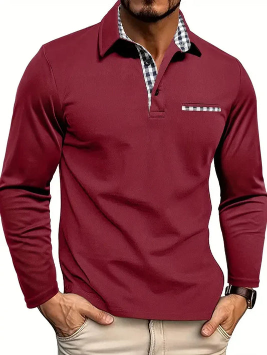 Model wearing the burgundy version, with gingham-lined collar and placket, matching chest pocket trim, hands in beige trousers. 1