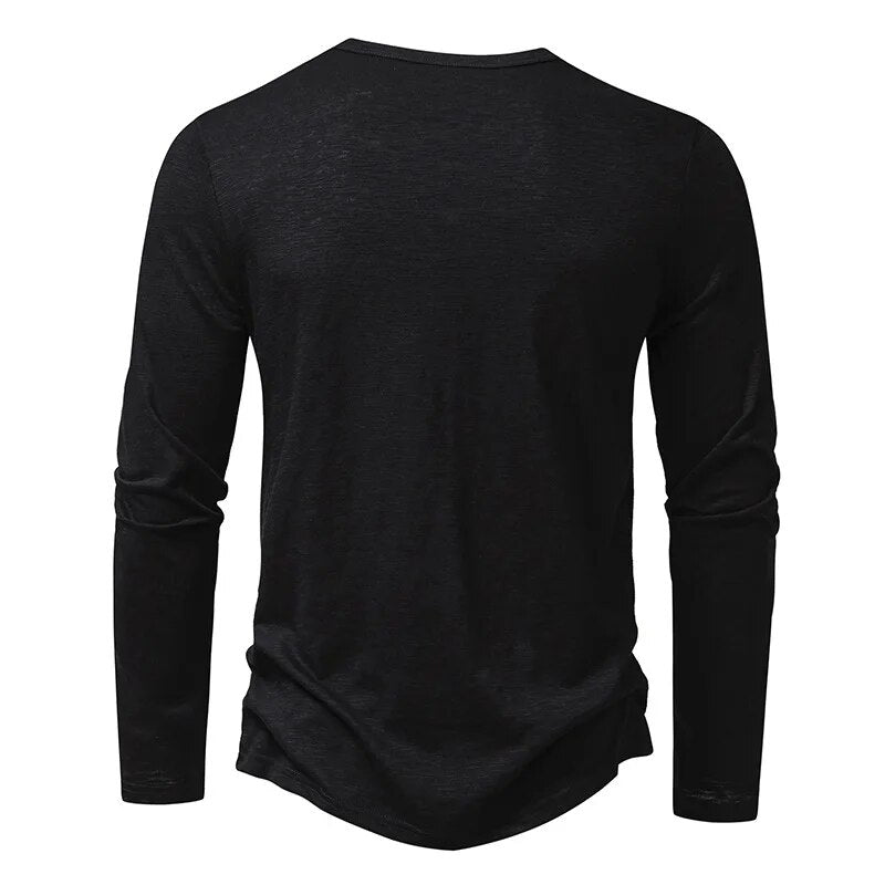 Back view of the black long-sleeved henley, plain with a round neckline and curved hem 17