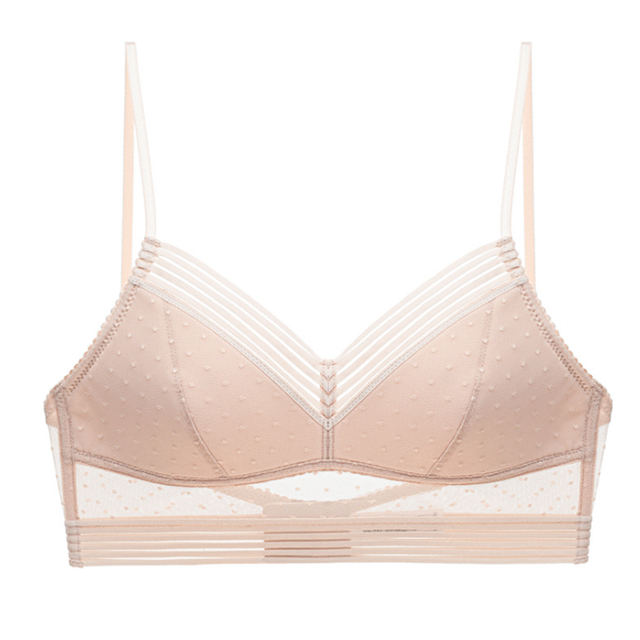 Nude-pink bralette on a plain background, front view, showing striped V-neck trim, dotted mesh panels and thin straps. 11