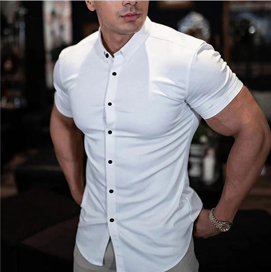 Model wears the white version with contrasting black buttons, one hand on hip, in a dim indoor setting 2