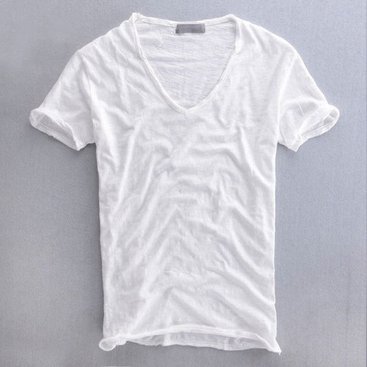Same V-neck t-shirt in white, laid flat from the front, with a slightly sheer slub texture and raw-edged neckline. 2
