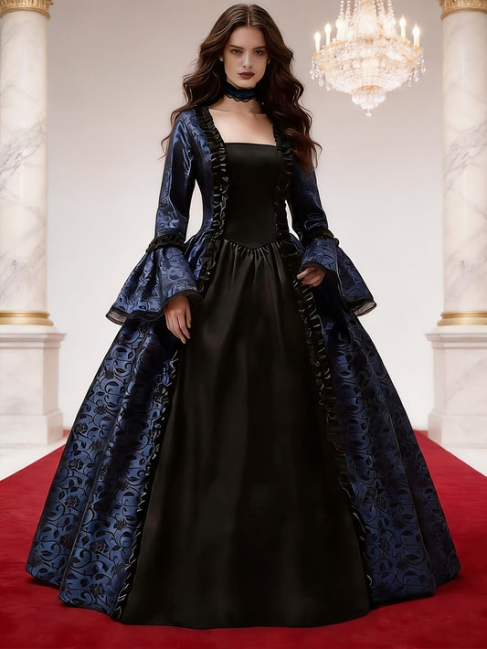 Model wearing the navy gown with black front panel, ruffle trim and flared lace-edged sleeves, on a red carpet beneath a chandelier. 2