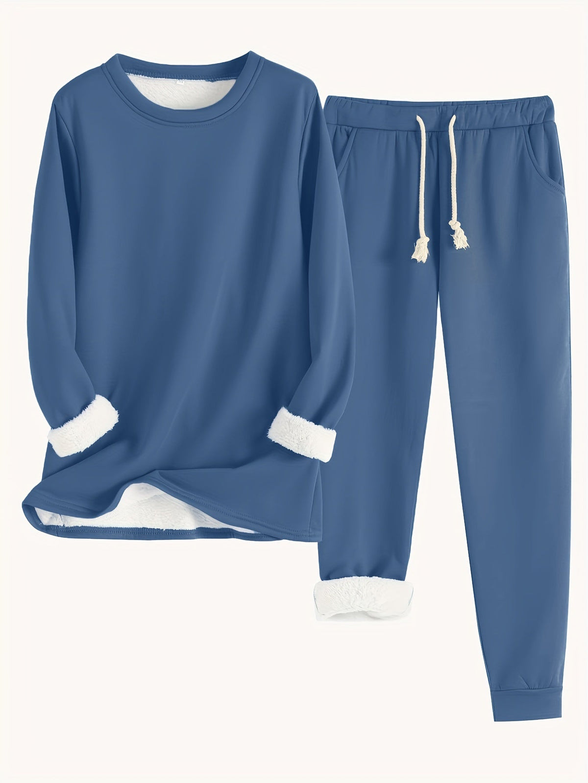 Flat lay of the set in mid blue, with white fleece lining visible at cuffs and hem 14