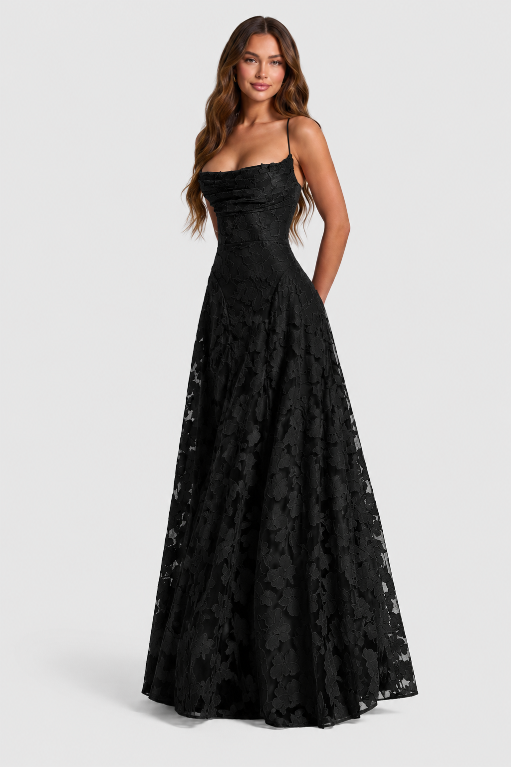Model wearing the black floral lace A-line dress with thin straps and draped cowl neckline, shown at a three-quarter angle. 21