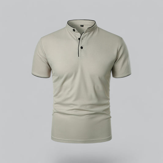 Front view of a pale stone-coloured short-sleeved shirt with black piping and three black buttons 2