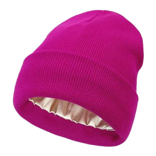 Bright magenta ribbed knit beanie with folded cuff, showing the pale gold satin lining 13