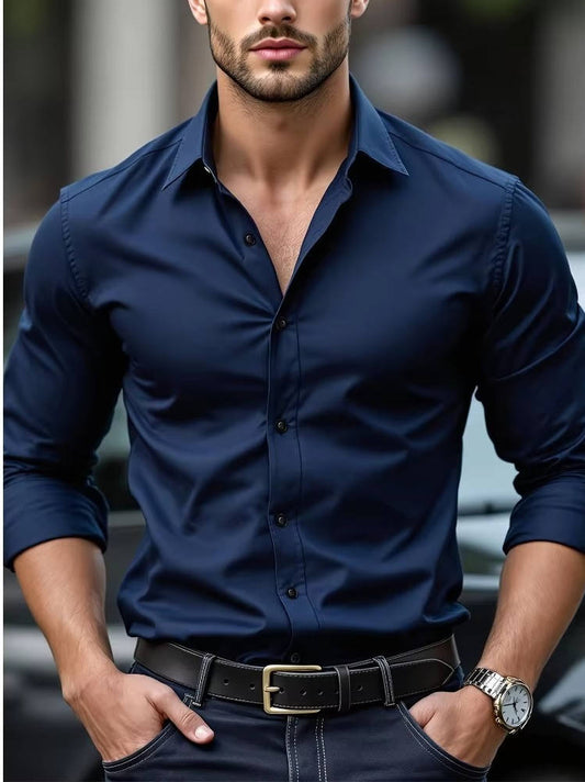Model wearing the shirt in navy with sleeves rolled, hands in jeans pockets, black belt 2