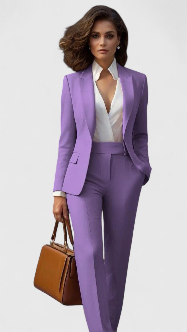 Model wearing the set in lilac purple with a white wrap blouse and tan handbag 9