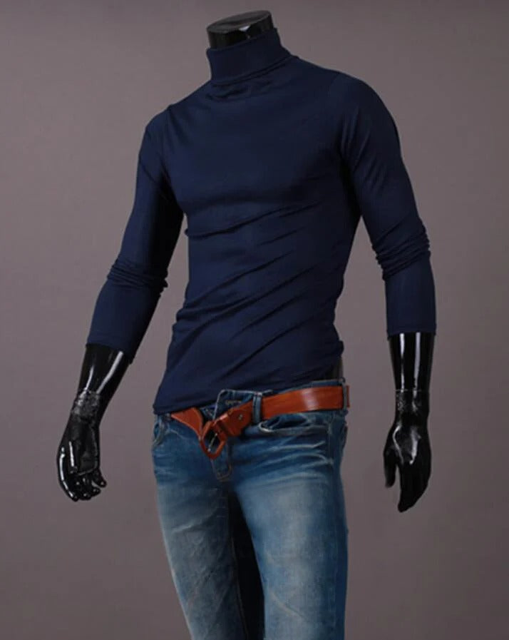 Navy high neck top styled on a headless mannequin with blue jeans and a tan leather belt 13