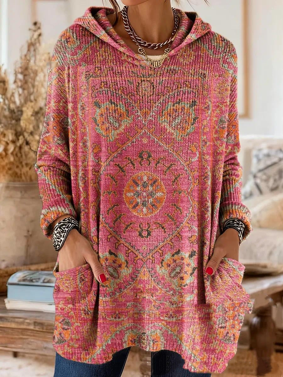 Pink version with an orange and green medallion print on the ribbed knit, shown on a model with hands in the pockets. 6