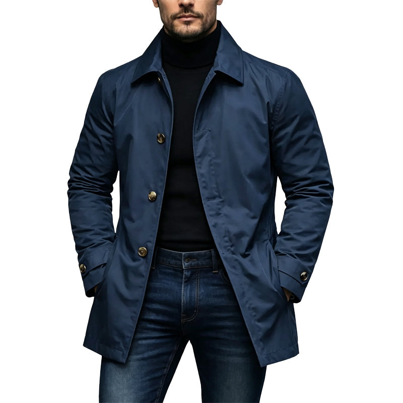 Man wearing the coat in navy blue with gold-toned buttons, black polo neck and jeans 4