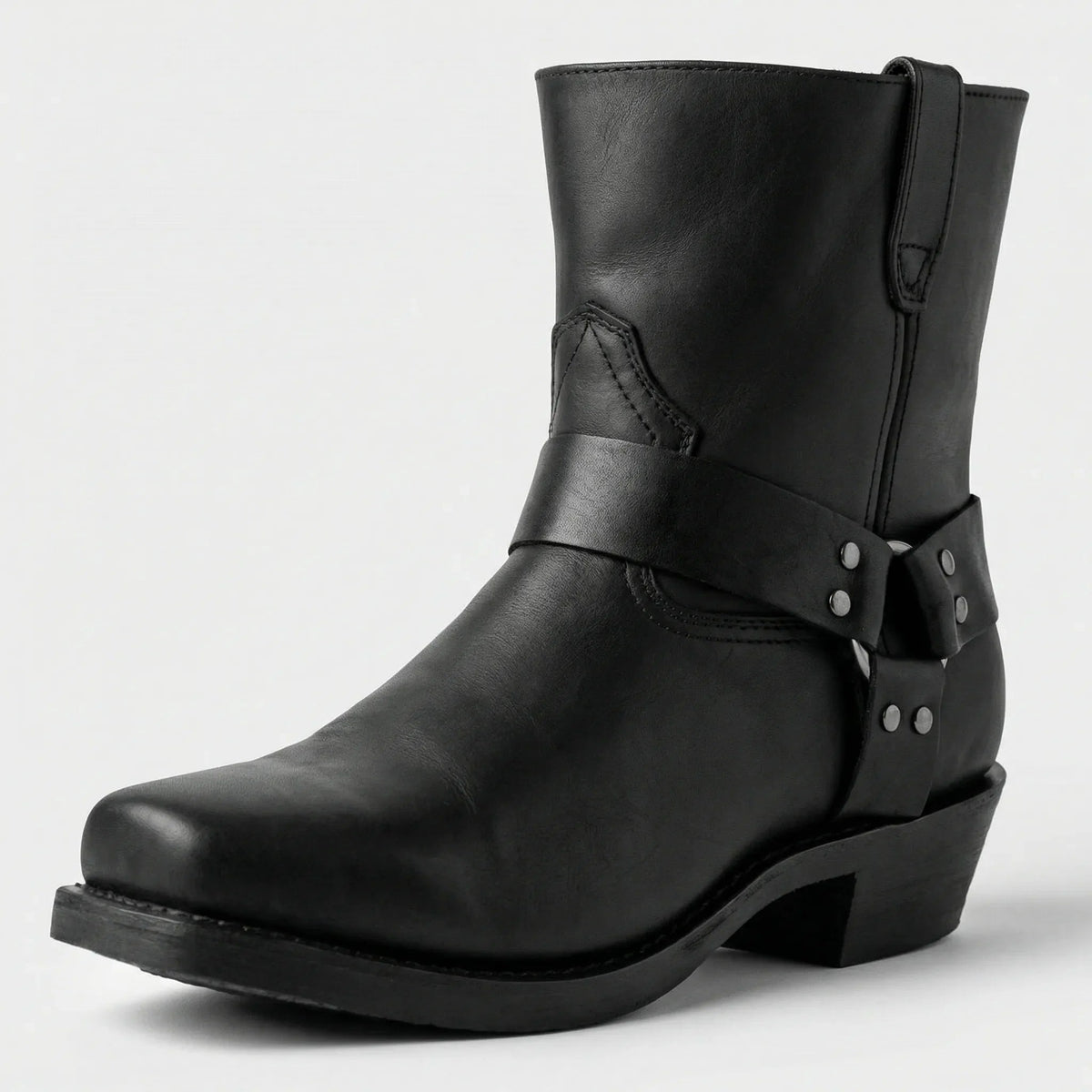 Black version of the mid-calf harness boot, shown from the front corner with a riveted strap and square toe. 5