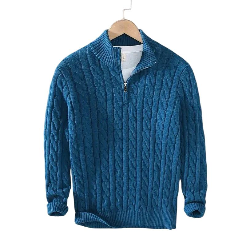 Deep teal blue cable knit jumper on a wooden hanger, with ribbed cuffs, hem and short zip 5