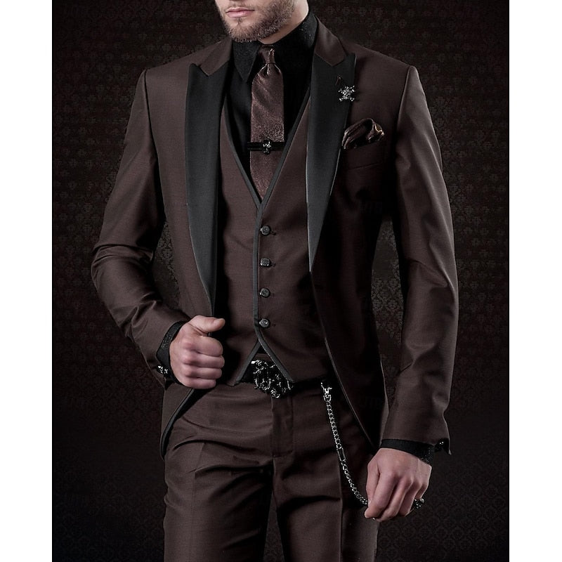 Model in a dark brown three-piece suit with black peak lapels, black shirt, brown tie and a chain hanging from the trousers. 7
