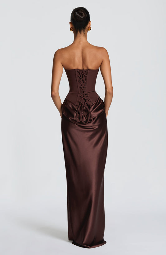 Back view of the brown dress showing the lace-up corset back and trailing ties 2