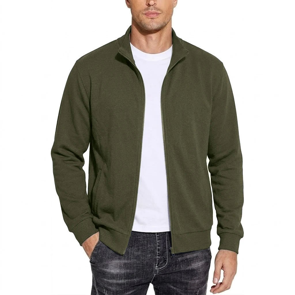 Front view of the zip-up sweatshirt jacket in olive green, worn open over a white tee and faded dark jeans. 6