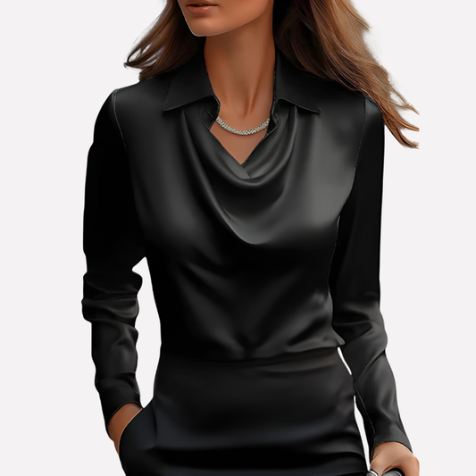 Model wearing the black satin blouse with draped cowl neckline and collar, styled with a black skirt 2