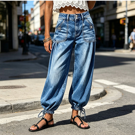 Front view of the washed blue jeans worn on a sunny street with black sandals 2
