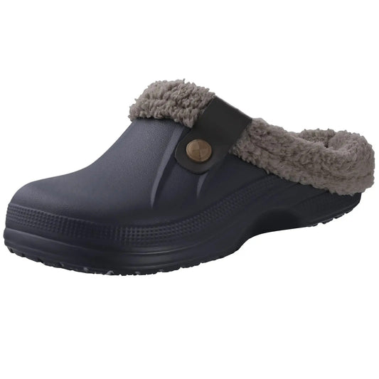 Dark navy clog with taupe fleece lining and a dark strap fastened with a bronze button 2