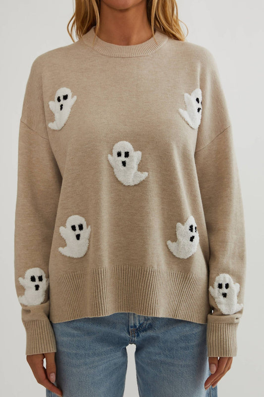 Close front view of the beige knit showing fluffy white ghost appliqués on the body and sleeves 2