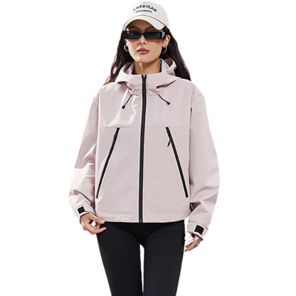 Front view of the jacket in pale pink, worn open-handed with black leggings and a white cap 9