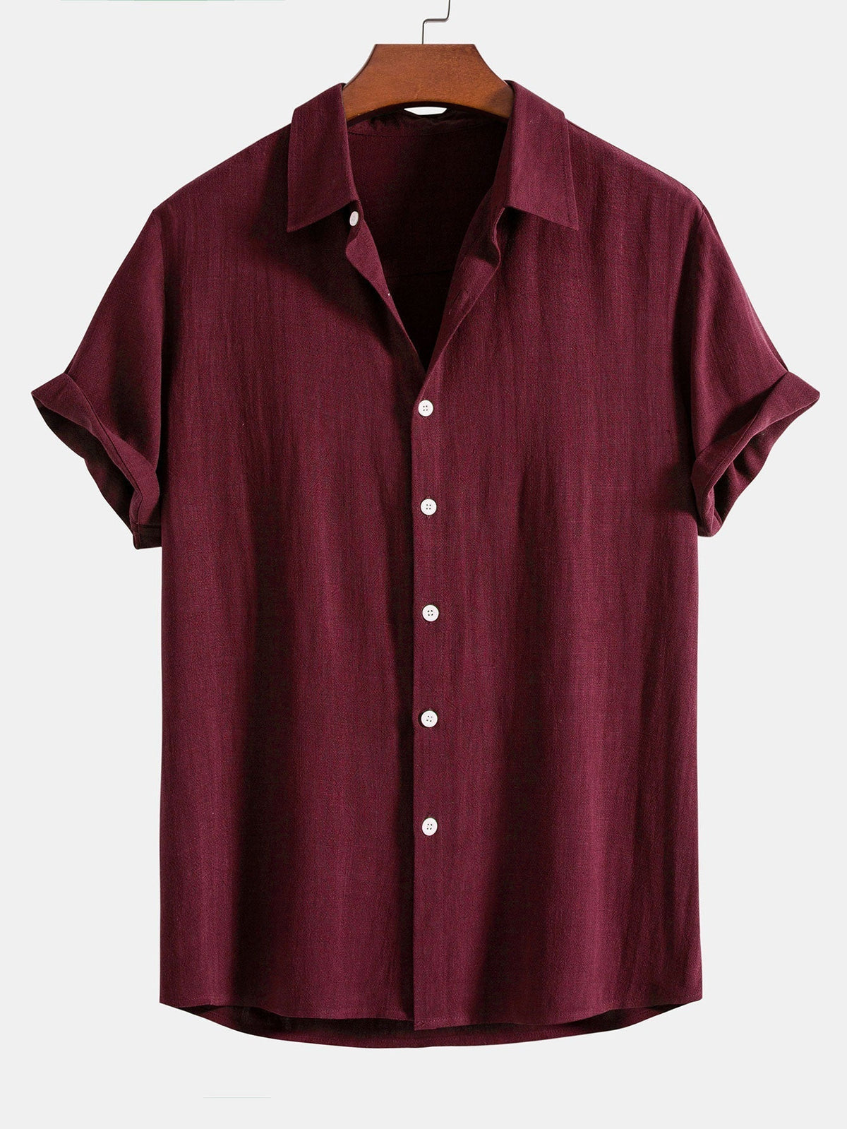 Burgundy short-sleeved shirt on a wooden hanger, front view with white buttons and turned-up sleeves. 7
