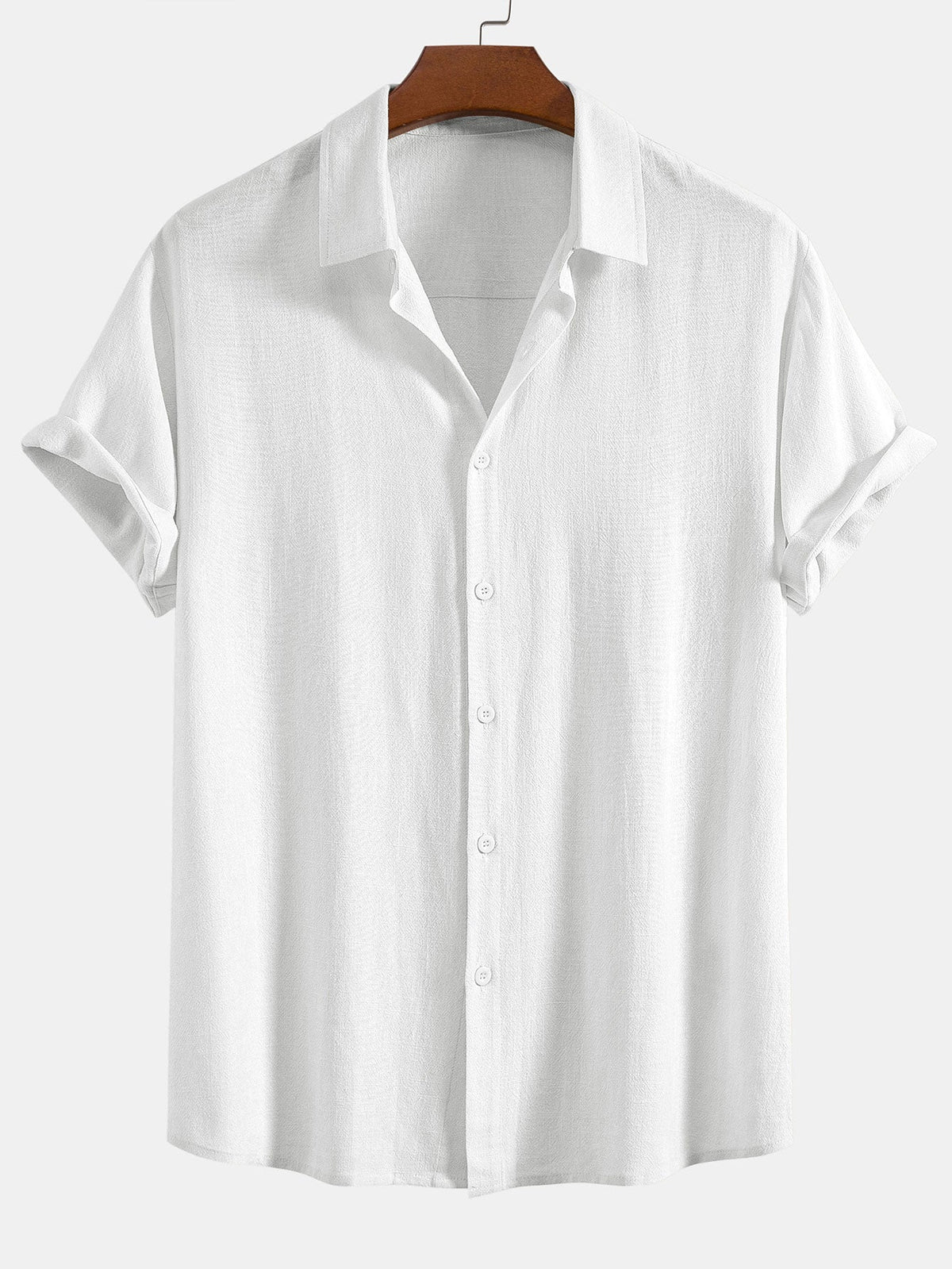 White short-sleeved shirt on a wooden hanger, front view with a textured weave, matching white buttons and cuffed sleeves. 6