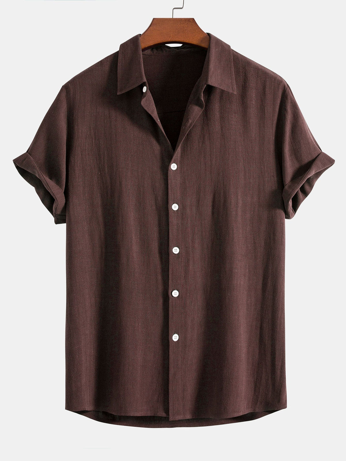 Dark chocolate brown short-sleeved shirt on a wooden hanger, front view with white buttons and cuffed sleeves. 8