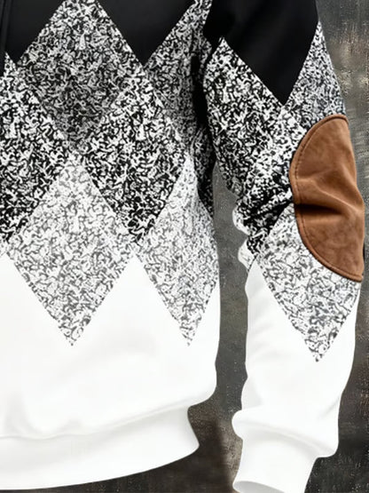 Close-up of the grey argyle pattern, ribbed hem and brown elbow patch on the sleeve 4