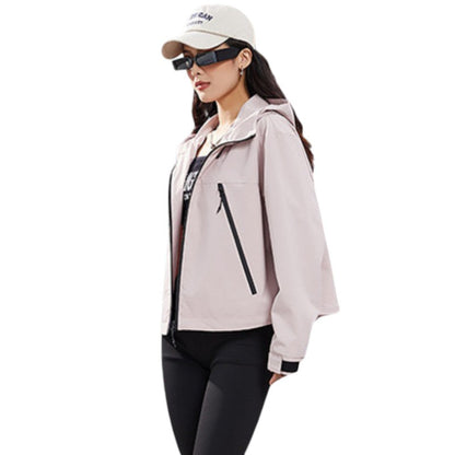 Side view of the pale pink jacket worn unzipped over a dark top, showing a diagonal pocket zip 11