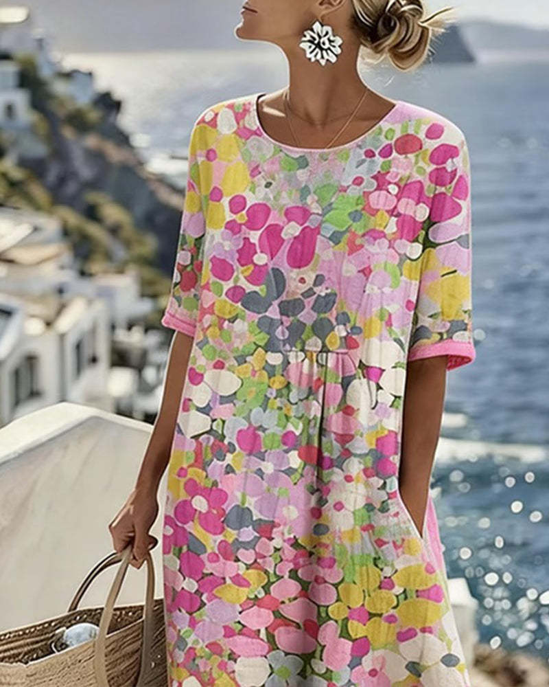 Close-up of the pink floral dress's round neckline, short sleeves and gathered waist on a model 3