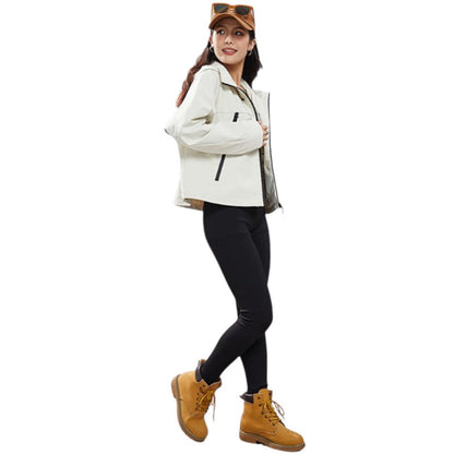 Woman in the cream jacket and tan boots, turned sideways and glancing back over her shoulder 8