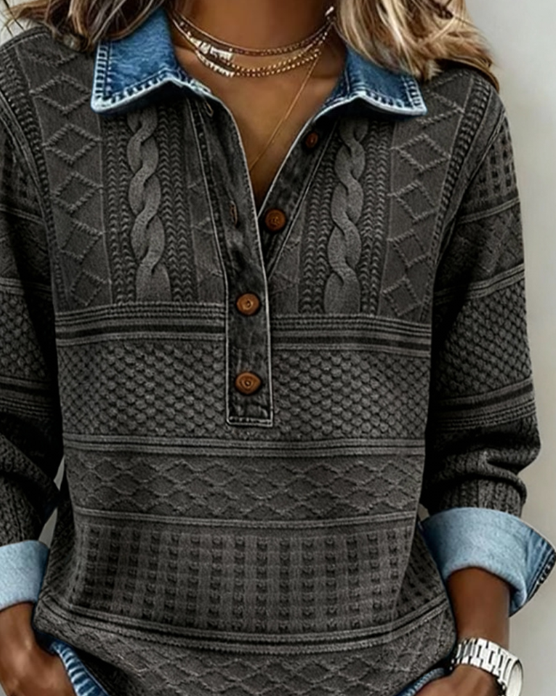 Close-up of the charcoal grey sweater's blue denim collar and half-button placket on the model 6