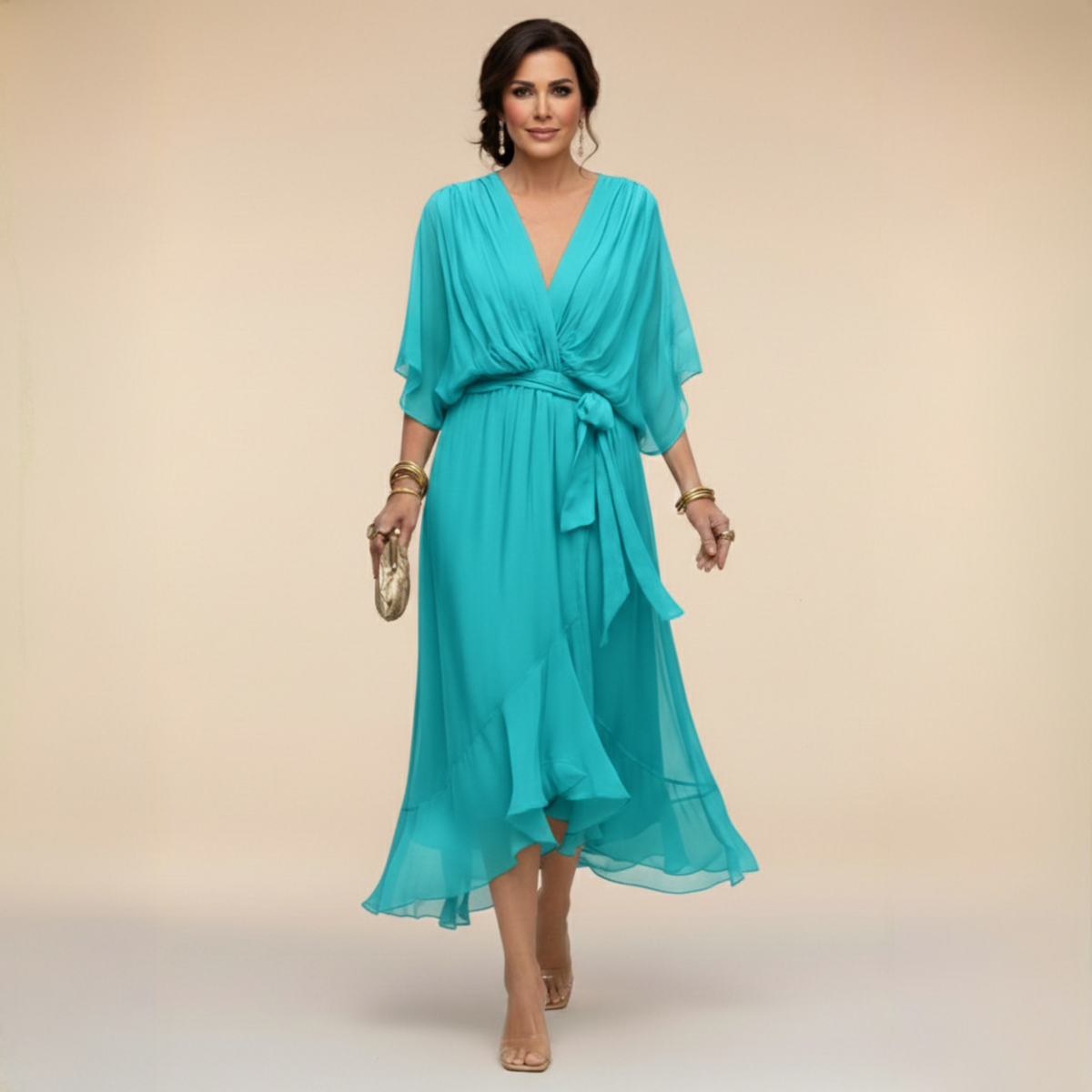 Model in the turquoise chiffon midi dress with plunging V-neck, loose batwing sleeves, tied waist and layered ruffled skirt. 5