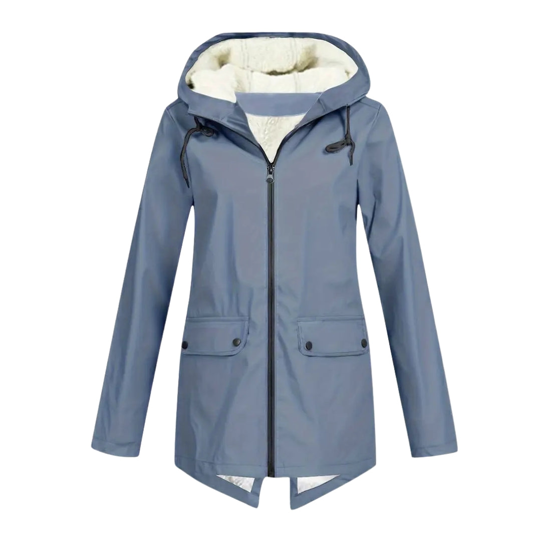 Flat front view of the jacket in dusty blue-grey, showing the cream fleece-lined hood, centre zip and two buttoned flap pockets. 9